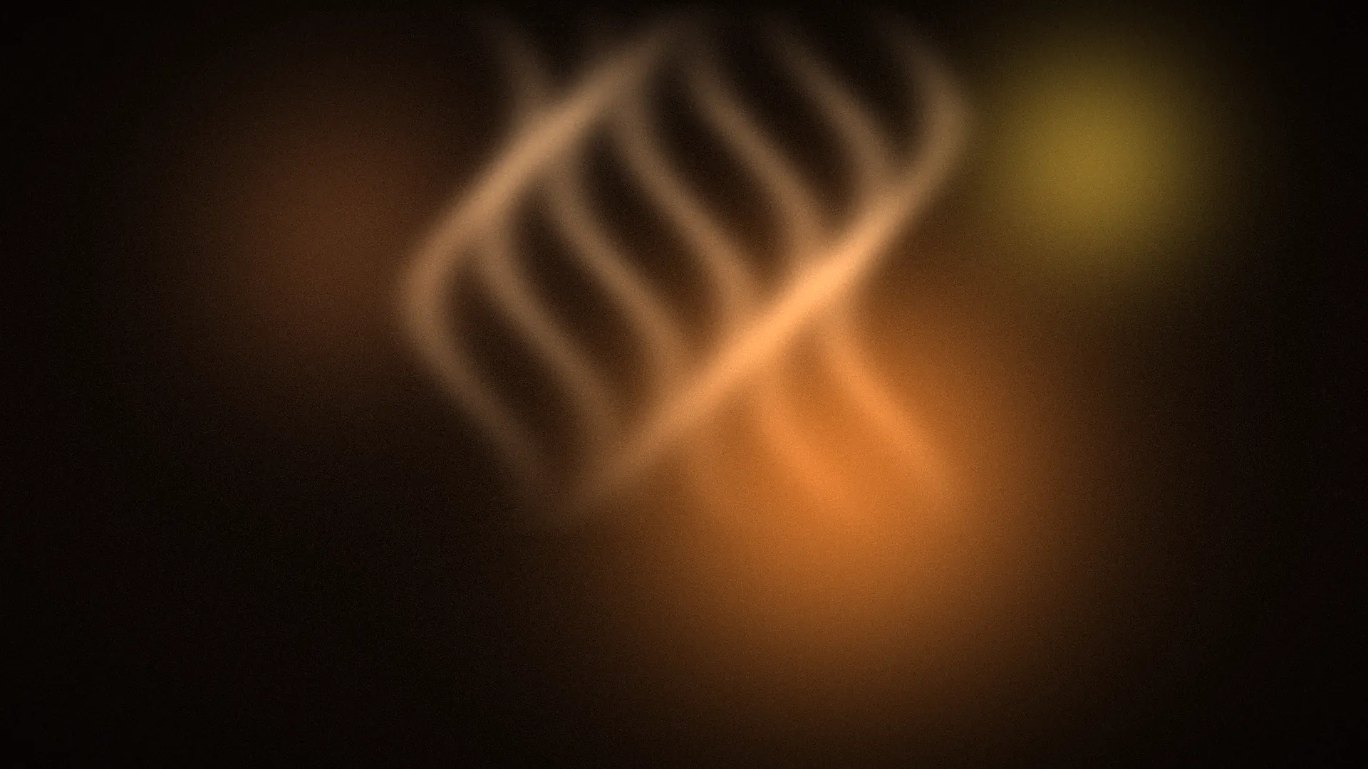 Concept image: warm light and curling steam on a black background